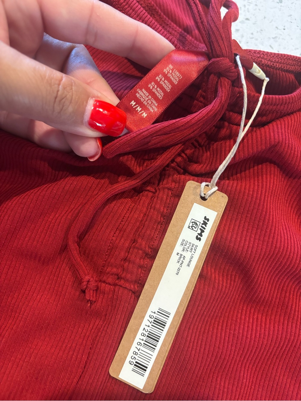 SKIMS Ribbed Drawstring Athletic Shorts in Deep Red